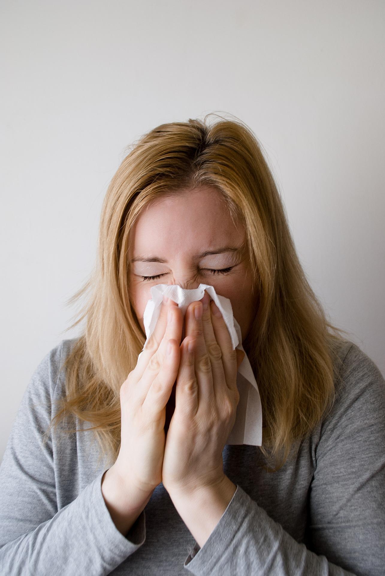 Woman sneezing